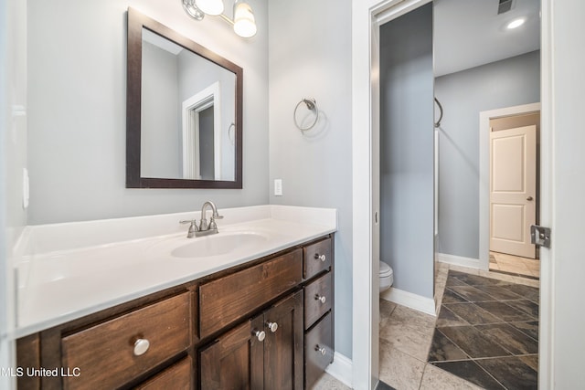 905 Franklin St, Corinth, MS 38834 - full bath featuring vanity, baseboards, and toilet