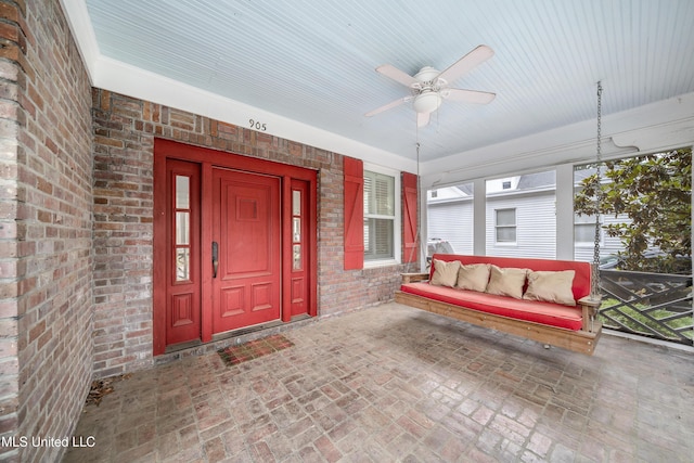 905 Franklin St, Corinth, MS 38834 - entrance to property with brick siding, ceiling fan, and covered porch