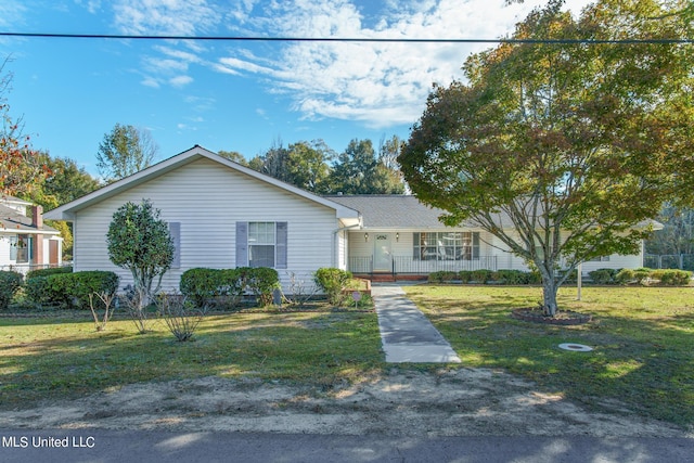 ranch-style home featuring a porch and a front lawn