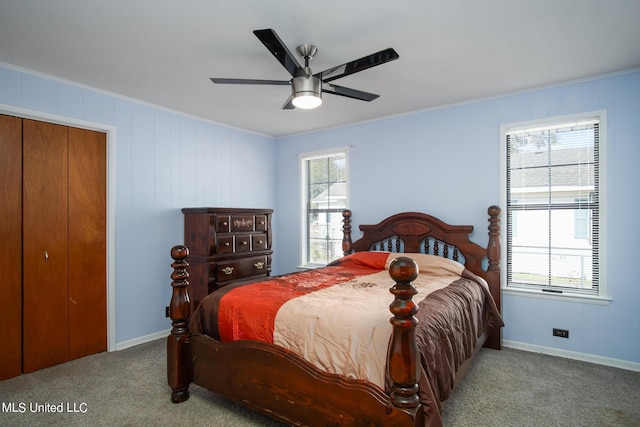 bedroom with multiple windows, crown molding, and carpet