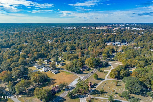 aerial view featuring a wooded view