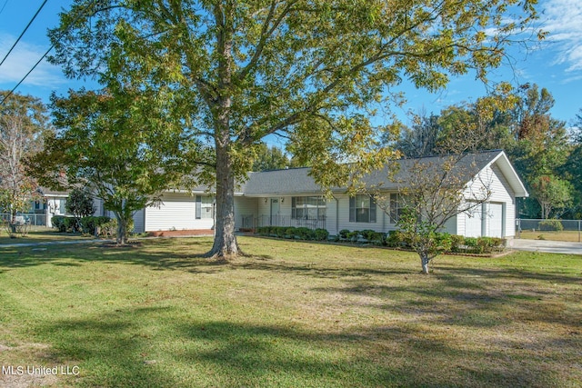 ranch-style house with a garage, concrete driveway, a front lawn, and fence