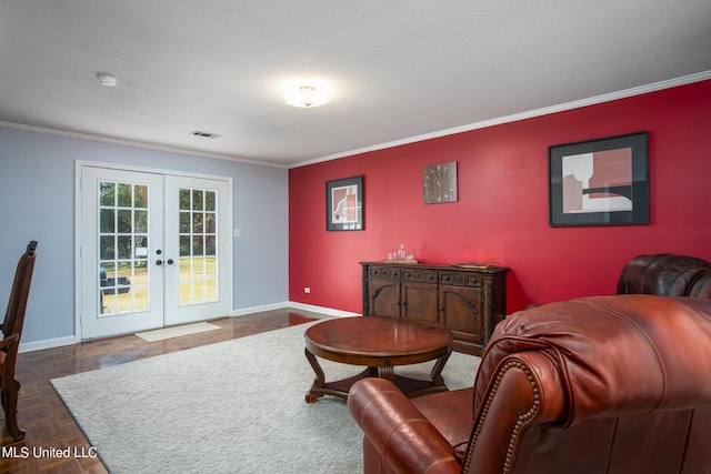 living room with crown molding, french doors, baseboards, and visible vents