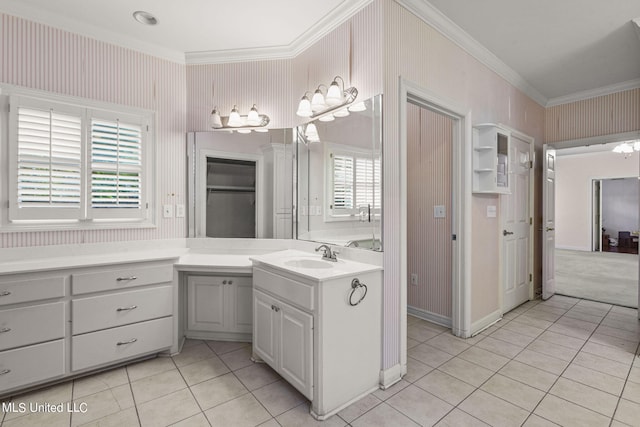 bathroom featuring vanity, tile patterned floors, and ornamental molding