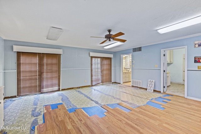 spare room featuring ceiling fan, ornamental molding, and light hardwood / wood-style flooring