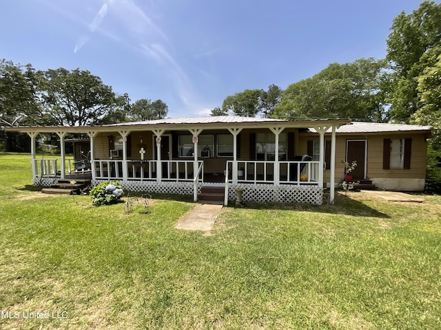 260 SCR 62, Magee, MS 39111 - view of front of property featuring a porch, a front yard, and metal roof