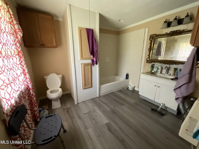 260 SCR 62, Magee, MS 39111 - bathroom with vanity, toilet, a bath, wood finished floors, and baseboards