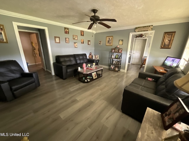 260 SCR 62, Magee, MS 39111 - living area featuring ceiling fan, wood finished floors, crown molding, a textured ceiling, and baseboards