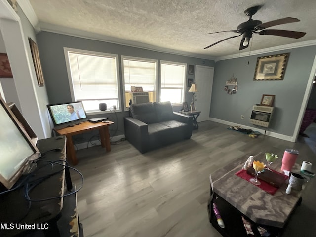 260 SCR 62, Magee, MS 39111 - living room with heating unit, ornamental molding, a ceiling fan, wood finished floors, and a textured ceiling