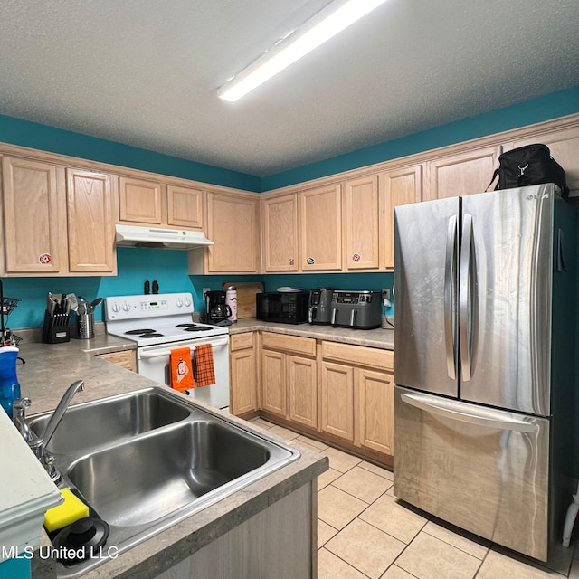 kitchen with stainless steel refrigerator, sink, white range with electric stovetop, a textured ceiling, and light tile patterned flooring