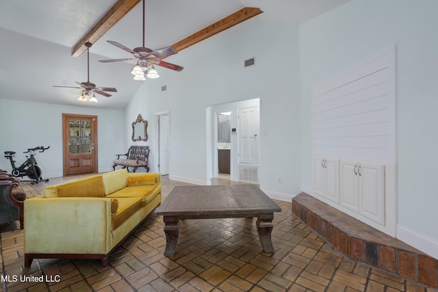 living room featuring beamed ceiling, high vaulted ceiling, and ceiling fan