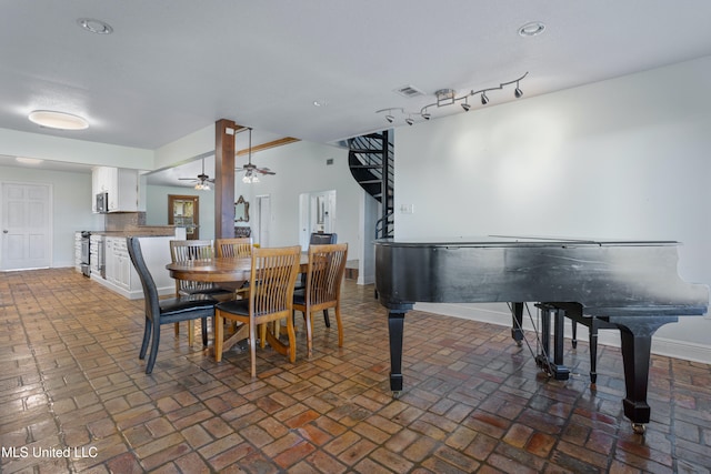 dining space featuring ceiling fan