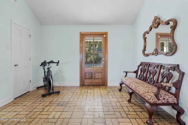 foyer entrance with lofted ceiling