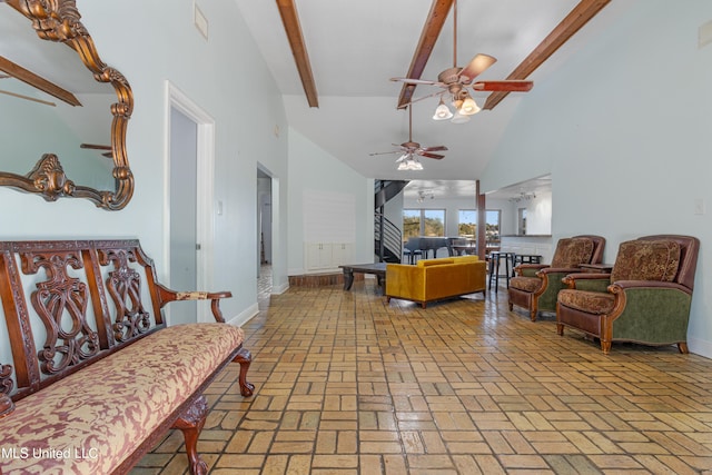 living room with beamed ceiling, high vaulted ceiling, and ceiling fan