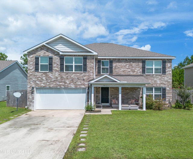 view of front of home with a garage and a front lawn