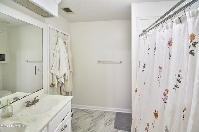 bathroom with vanity and walk in shower