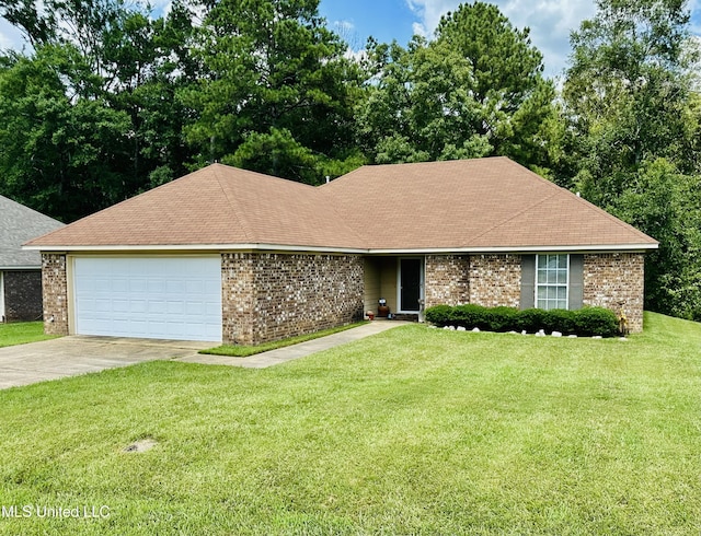 235 Gaddy Dr, Byram, MS 39272 - view of front of house featuring concrete driveway, a garage, a front lawn, and brick siding