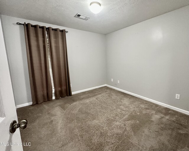 235 Gaddy Dr, Byram, MS 39272 - empty room featuring carpet and a textured ceiling