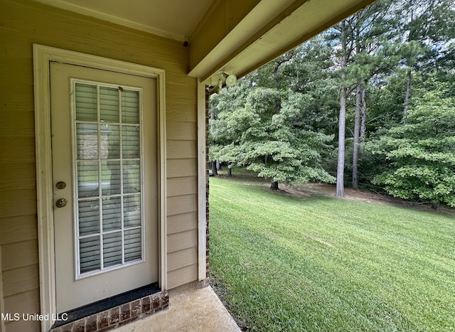 235 Gaddy Dr, Byram, MS 39272 - doorway to property featuring a lawn