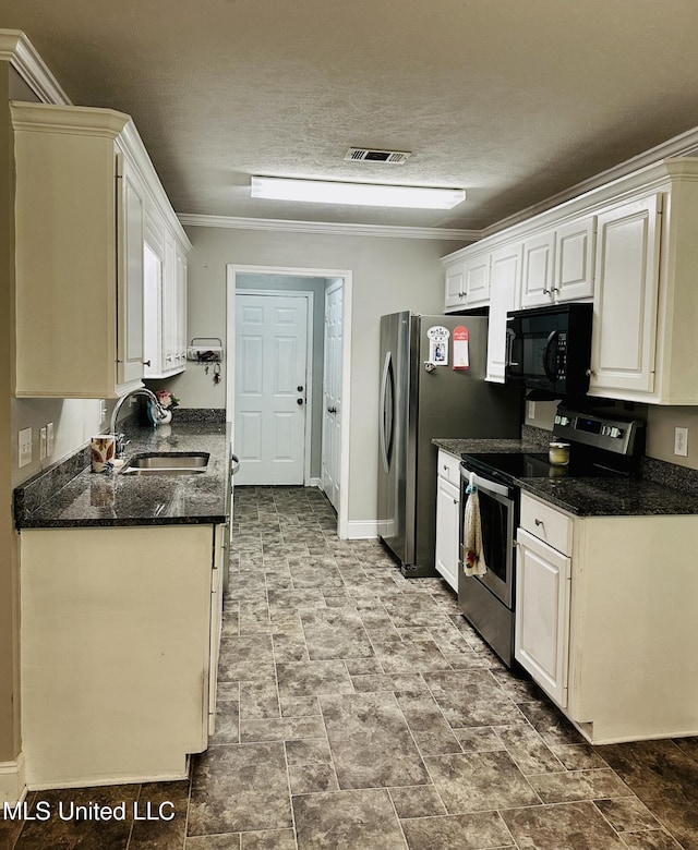 235 Gaddy Dr, Byram, MS 39272 - kitchen with stainless steel appliances, crown molding, white cabinets, dark stone counters, and a textured ceiling