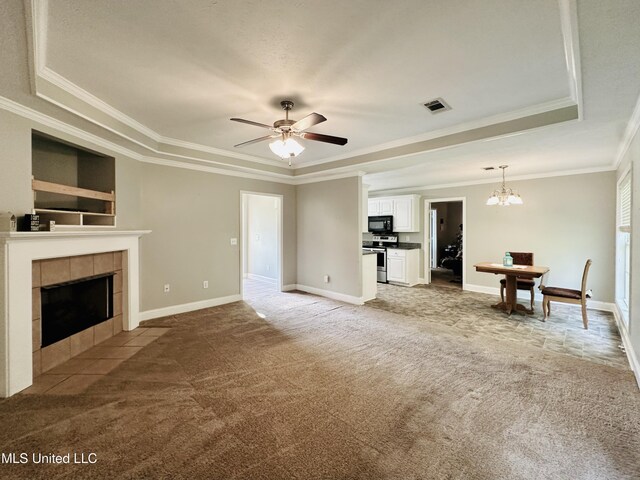 235 Gaddy Dr, Byram, MS 39272 - living room featuring light colored carpet, a fireplace, ornamental molding, a ceiling fan, and a chandelier