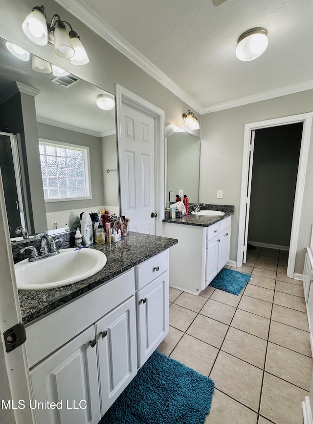 235 Gaddy Dr, Byram, MS 39272 - full bathroom featuring ornamental molding, two vanities, a shower stall, tile patterned floors, and a textured ceiling