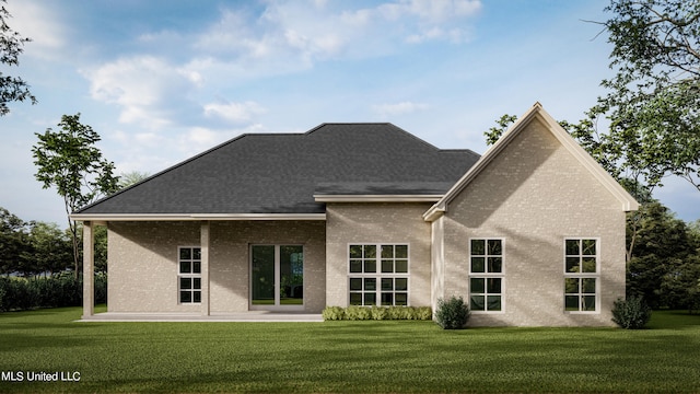 rear view of house with a patio and a lawn