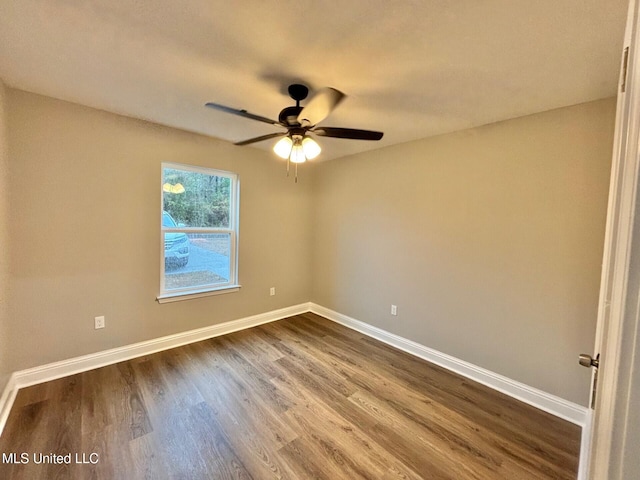 spare room with hardwood / wood-style flooring and ceiling fan