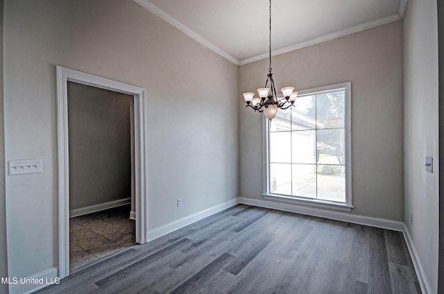 508 Jasmine Ct, Brandon, MS 39047 - unfurnished dining area featuring a healthy amount of sunlight, a chandelier, wood finished floors, and ornamental molding