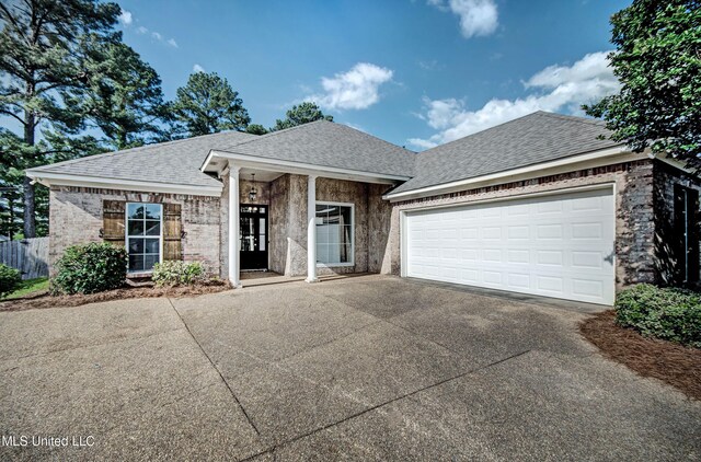 508 Jasmine Ct, Brandon, MS 39047 - ranch-style home with concrete driveway, a shingled roof, an attached garage, and fence