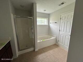 134 Shadow Ln, Batesville, MS 38606 - bathroom with a bath, vanity, a shower stall, and tile patterned flooring