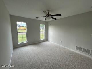 134 Shadow Ln, Batesville, MS 38606 - spare room with carpet, baseboards, and ceiling fan