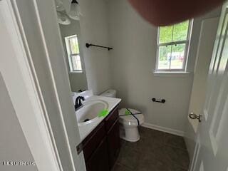 134 Shadow Ln, Batesville, MS 38606 - bathroom featuring vanity, toilet, and baseboards