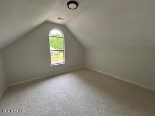 134 Shadow Ln, Batesville, MS 38606 - bonus room with lofted ceiling, carpet flooring, and baseboards