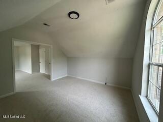 134 Shadow Ln, Batesville, MS 38606 - additional living space featuring lofted ceiling, healthy amount of natural light, carpet, and baseboards