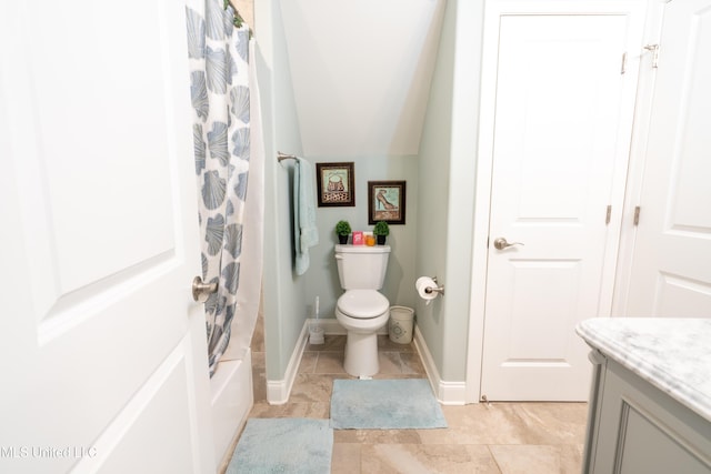 bathroom with baseboards, toilet, lofted ceiling, shower / bath combination with curtain, and vanity