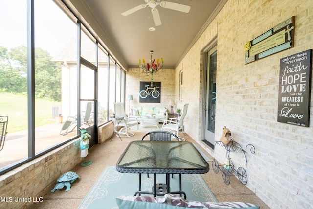 sunroom with a ceiling fan