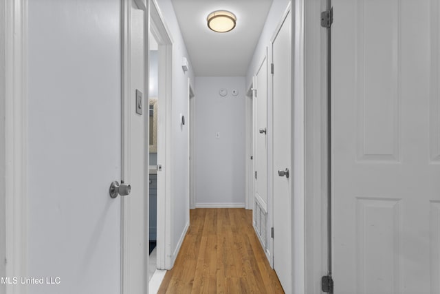 12509 Ponce De Leon Dr, Ocean Springs, MS 39564 - corridor with light wood finished floors and baseboards