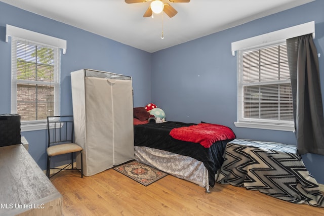 12509 Ponce De Leon Dr, Ocean Springs, MS 39564 - bedroom featuring a ceiling fan and wood finished floors