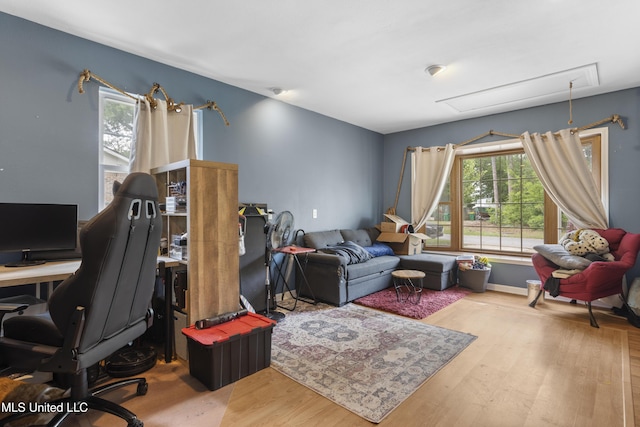 12509 Ponce De Leon Dr, Ocean Springs, MS 39564 - home office featuring attic access, a wealth of natural light, wood finished floors, and baseboards