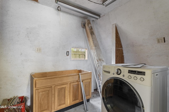 12509 Ponce De Leon Dr, Ocean Springs, MS 39564 - laundry room with cabinet space and washer / dryer