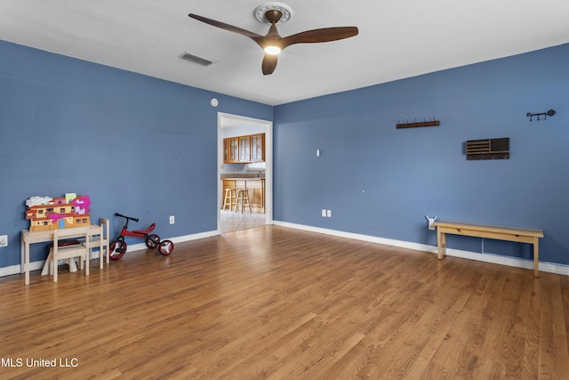 12509 Ponce De Leon Dr, Ocean Springs, MS 39564 - recreation room featuring baseboards, visible vents, wood finished floors, and a ceiling fan