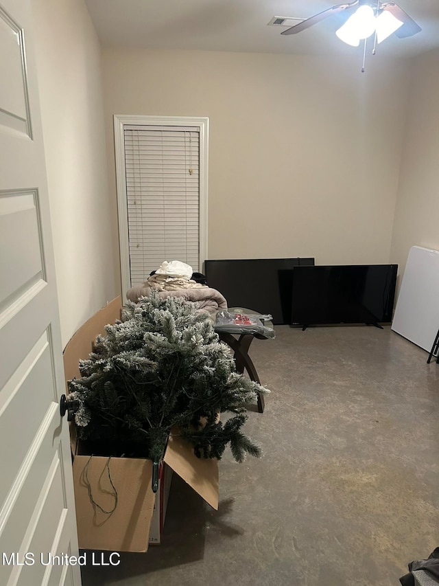 bedroom with concrete flooring and ceiling fan