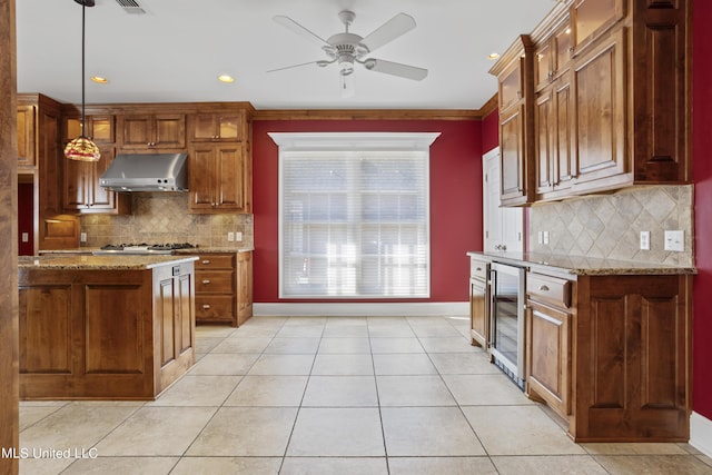 1529 Magnolia St Unit 15, Gulfport, MS 39507 - kitchen with ventilation hood, beverage cooler, light tile patterned floors, light stone countertops, and baseboards
