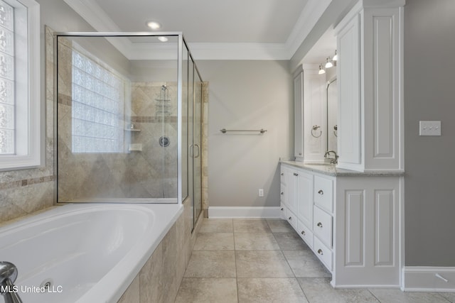 1529 Magnolia St Unit 15, Gulfport, MS 39507 - bathroom featuring crown molding, a garden tub, double vanity, a stall shower, and baseboards