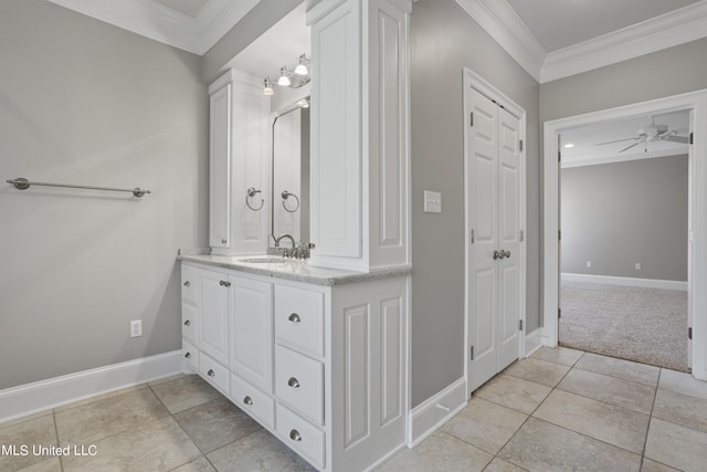 1529 Magnolia St Unit 15, Gulfport, MS 39507 - bathroom featuring vanity, ornamental molding, baseboards, tile patterned flooring, and ceiling fan