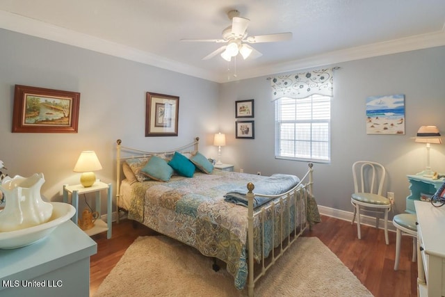 bedroom with ornamental molding, ceiling fan, and dark hardwood / wood-style flooring