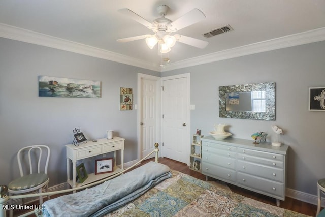 bedroom featuring ceiling fan, ornamental molding, and dark hardwood / wood-style floors