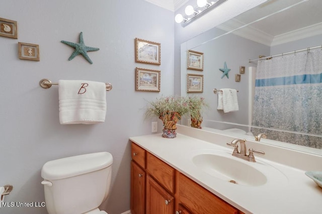 bathroom with a shower with curtain, ornamental molding, vanity, and toilet