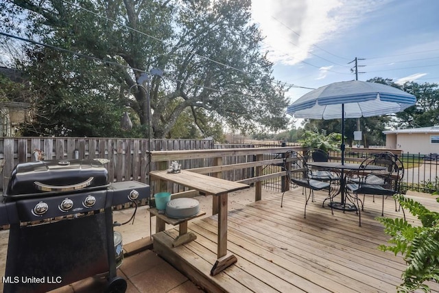 wooden deck featuring area for grilling